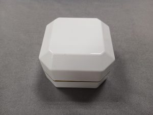 Octagonal light ring jewelry package box, white on the outside and gray on the inside